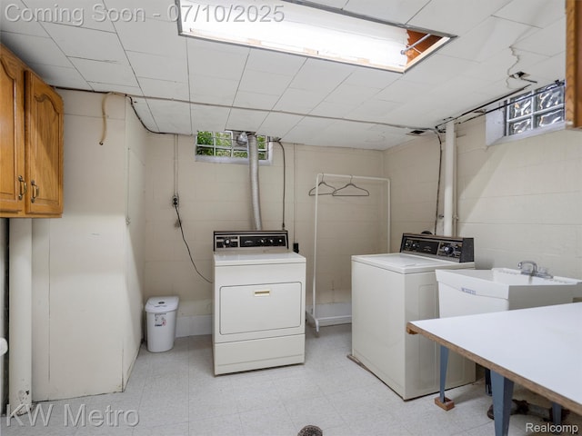 1877 Wiltshire Rd, Berkley, MI 48072 - washroom with cabinet space, washing machine and dryer, concrete block wall, and light flooring
