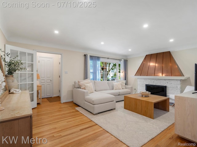 1877 Wiltshire Rd, Berkley, MI 48072 - living room featuring light wood finished floors, a fireplace, and recessed lighting