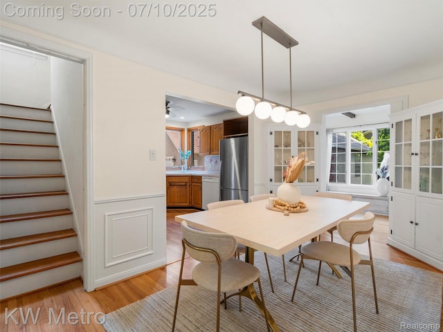 1877 Wiltshire Rd, Berkley, MI 48072 - dining room with stairs, light wood-style floors, and a ceiling fan
