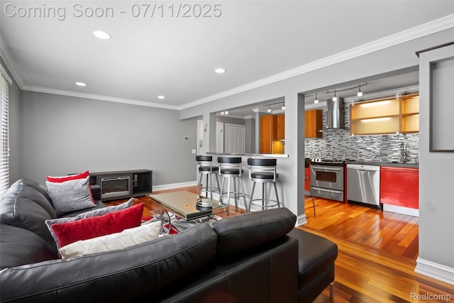 532 E Fox Hills Dr, Bloomfield Hills, MI 48304 - living room with light wood-style flooring, recessed lighting, and ornamental molding