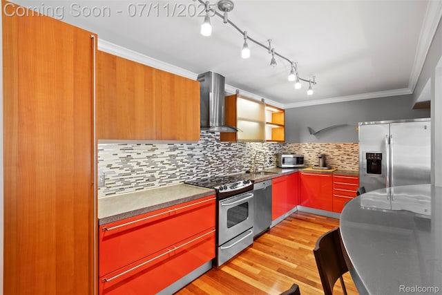 532 E Fox Hills Dr, Bloomfield Hills, MI 48304 - kitchen featuring wall chimney exhaust hood, appliances with stainless steel finishes, light wood finished floors, backsplash, and ornamental molding