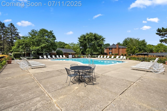 532 E Fox Hills Dr, Bloomfield Hills, MI 48304 - community pool featuring a patio and view of scattered trees
