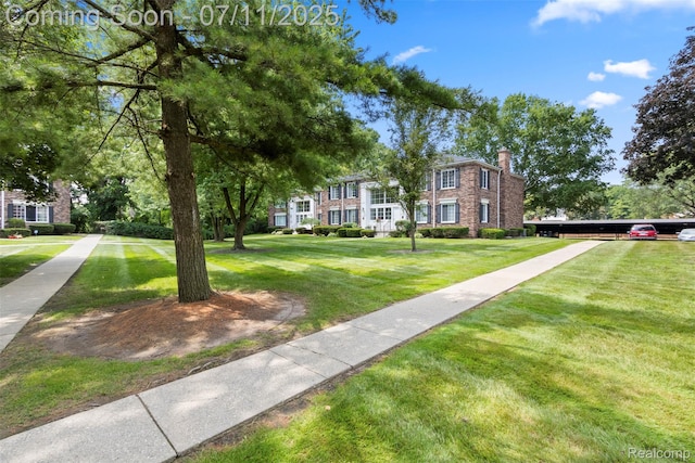 532 E Fox Hills Dr, Bloomfield Hills, MI 48304 - view of front of property featuring a chimney, a front lawn, and brick siding