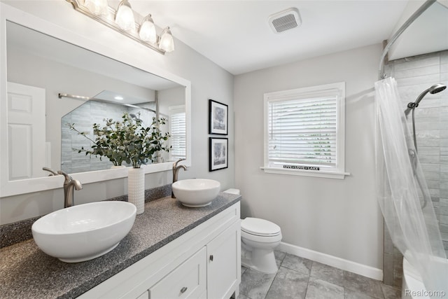 2009 Ridge Rd, White Lake, MI 48383 - full bathroom featuring double vanity and a tile shower