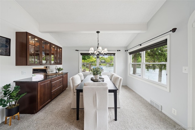 2009 Ridge Rd, White Lake, MI 48383 - dining area featuring plenty of natural light, a chandelier, and light carpet