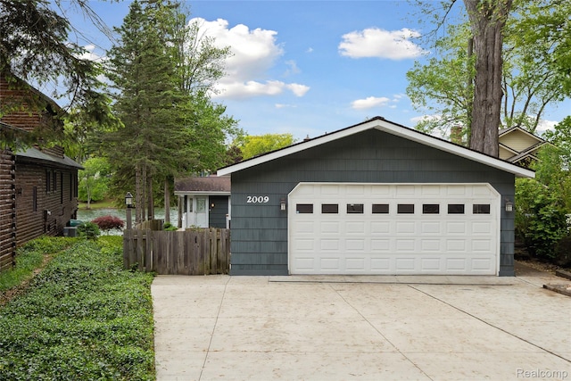 2009 Ridge Rd, White Lake, MI 48383 - view of front of property with a garage