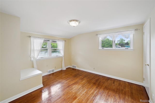 2009 Ridge Rd, White Lake, MI 48383 - spare room with healthy amount of natural light and wood finished floors