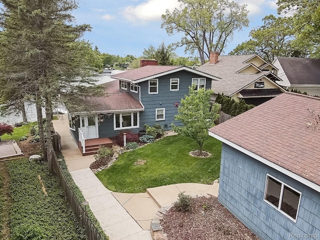 2009 Ridge Rd, White Lake, MI 48383 - back of house featuring a shingled roof
