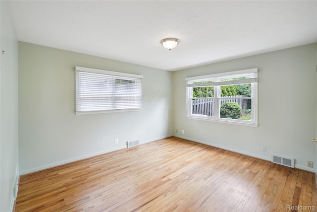 2009 Ridge Rd, White Lake, MI 48383 - spare room with hardwood / wood-style floors and baseboards