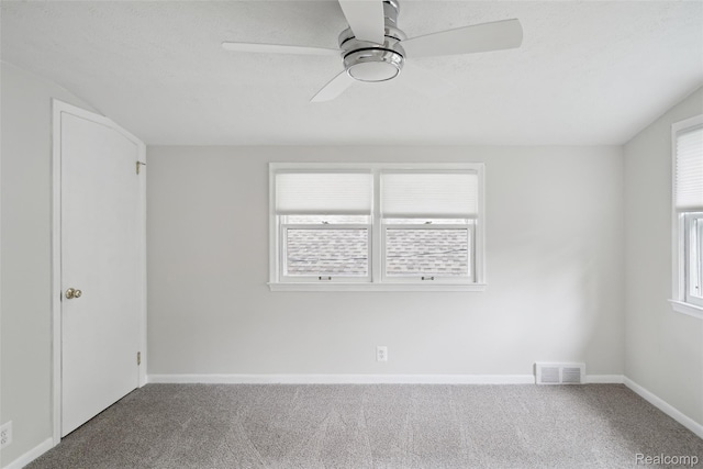 2009 Ridge Rd, White Lake, MI 48383 - carpeted spare room featuring a ceiling fan and plenty of natural light