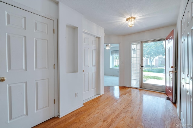 37306 Amhurst Dr, Westland, MI 48185 - foyer entrance with light wood-style floors and baseboards