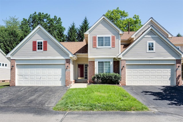 37306 Amhurst Dr, Westland, MI 48185 - view of front of property with driveway, brick siding, a garage, a front lawn, and a shingled roof