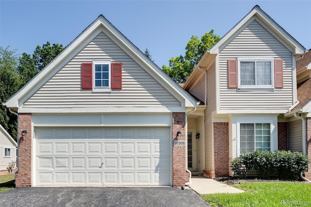 37306 Amhurst Dr, Westland, MI 48185 - view of front of property with brick siding and driveway