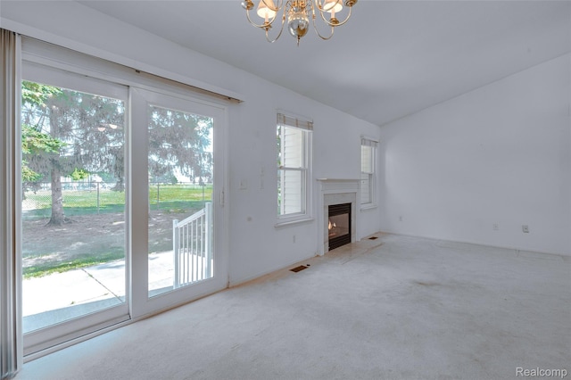 37306 Amhurst Dr, Westland, MI 48185 - unfurnished living room with a chandelier, carpet floors, a high end fireplace, and vaulted ceiling