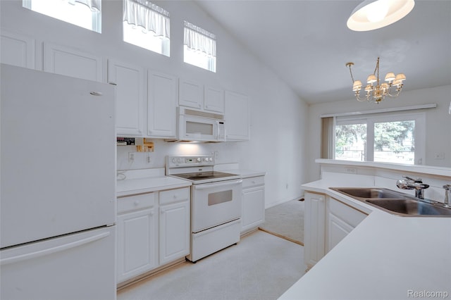 37306 Amhurst Dr, Westland, MI 48185 - kitchen with white appliances, plenty of natural light, white cabinets, and high vaulted ceiling