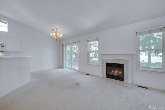 37306 Amhurst Dr, Westland, MI 48185 - unfurnished living room with a fireplace, carpet flooring, a chandelier, and vaulted ceiling