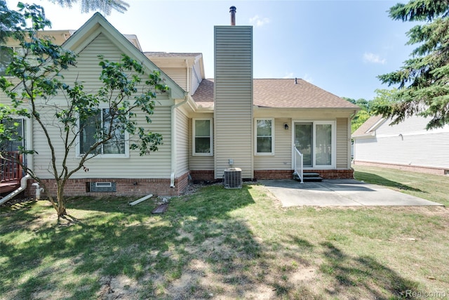 37306 Amhurst Dr, Westland, MI 48185 - back of house with a patio area, a yard, and a chimney