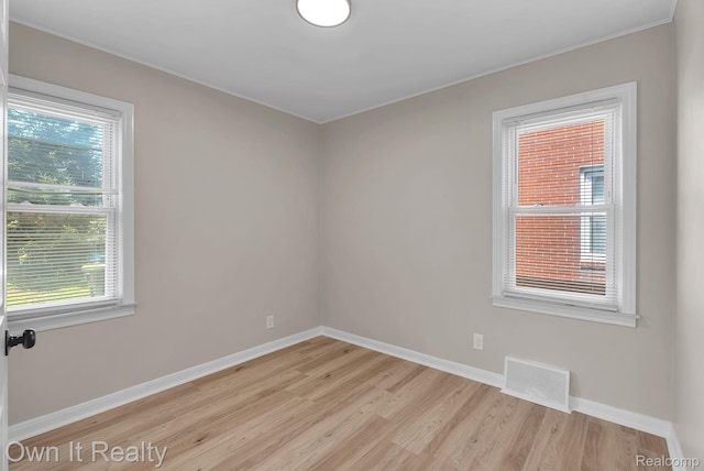 1389 Cleveland Ave, Northville, MI 48146 - unfurnished room featuring light wood finished floors and ornamental molding