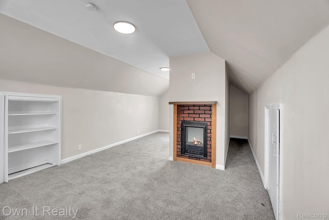 1389 Cleveland Ave, Northville, MI 48146 - unfurnished living room featuring carpet floors, lofted ceiling, a brick fireplace, and built in shelves