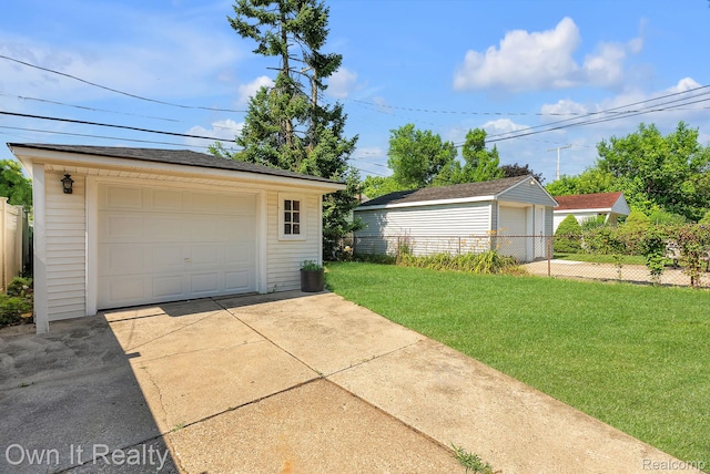 1389 Cleveland Ave, Northville, MI 48146 - detached garage featuring driveway
