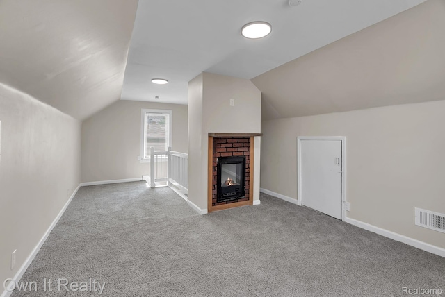 1389 Cleveland Ave, Northville, MI 48146 - unfurnished living room featuring carpet flooring, vaulted ceiling, and a brick fireplace