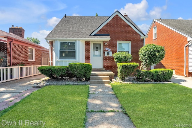 1389 Cleveland Ave, Northville, MI 48146 - bungalow-style house with a shingled roof, board and batten siding, and brick siding