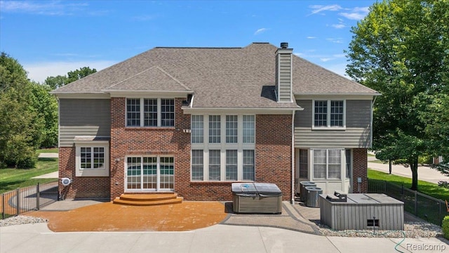 8507 Newbury Ct N, Canton, MI 48187 - back of house with brick siding, a patio area, a chimney, and roof with shingles