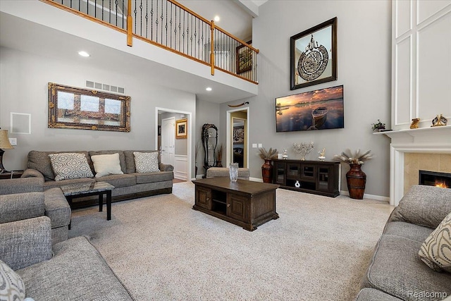 8507 Newbury Ct N, Canton, MI 48187 - carpeted living room with a high ceiling, a tile fireplace, and recessed lighting