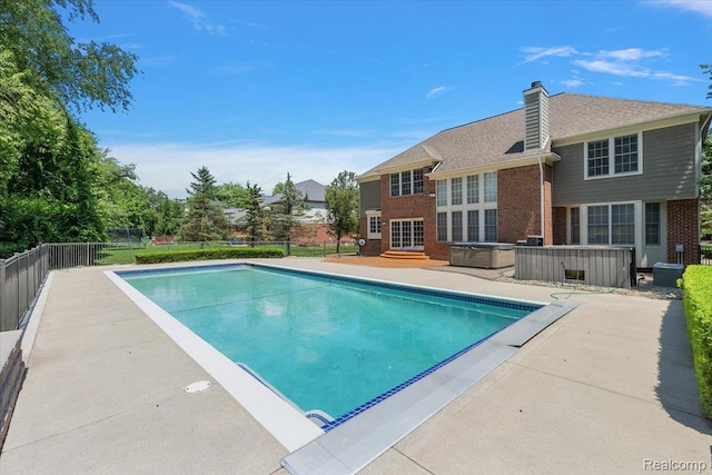 8507 Newbury Ct N, Canton, MI 48187 - view of swimming pool featuring a hot tub and a patio