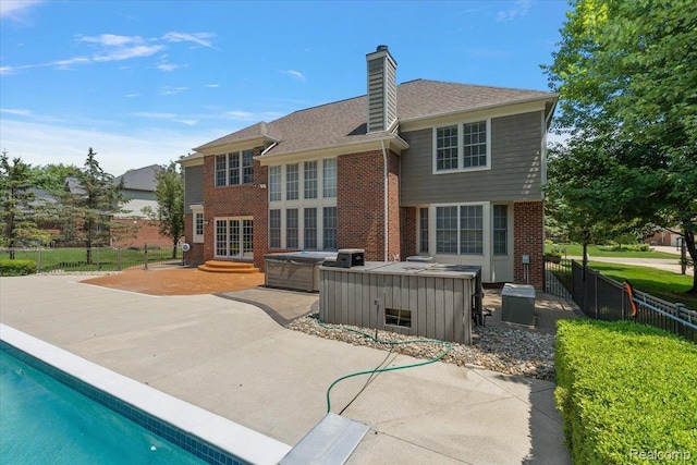 8507 Newbury Ct N, Canton, MI 48187 - back of house with a patio, brick siding, a fenced backyard, and a chimney