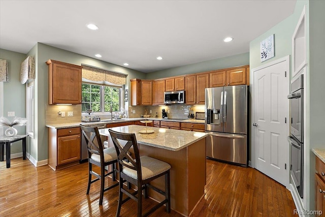 8507 Newbury Ct N, Canton, MI 48187 - kitchen featuring stainless steel appliances, dark wood-style floors, tasteful backsplash, and recessed lighting