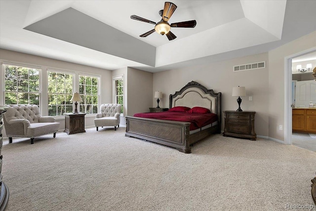 8507 Newbury Ct N, Canton, MI 48187 - bedroom featuring light colored carpet, a raised ceiling, a ceiling fan, and ensuite bathroom