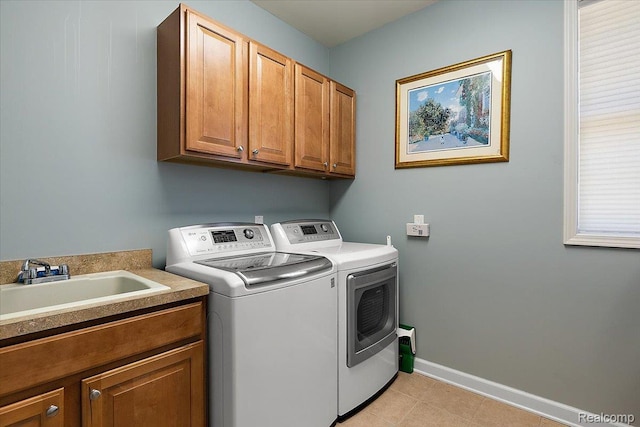 8507 Newbury Ct N, Canton, MI 48187 - laundry room with cabinet space, independent washer and dryer, and light tile patterned flooring
