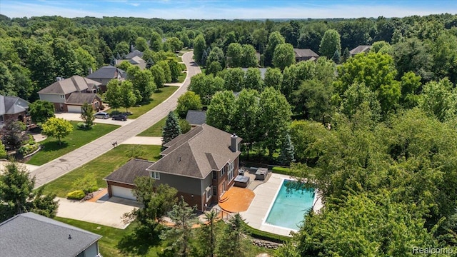 8507 Newbury Ct N, Canton, MI 48187 - bird's eye view of a pool area and a heavily wooded area