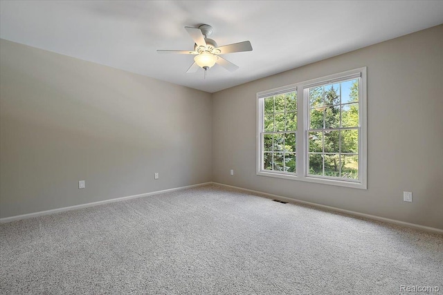 8507 Newbury Ct N, Canton, MI 48187 - carpeted spare room featuring ceiling fan and baseboards