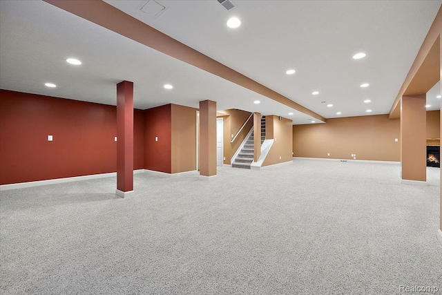 8507 Newbury Ct N, Canton, MI 48187 - finished basement featuring stairway, recessed lighting, light colored carpet, and a lit fireplace