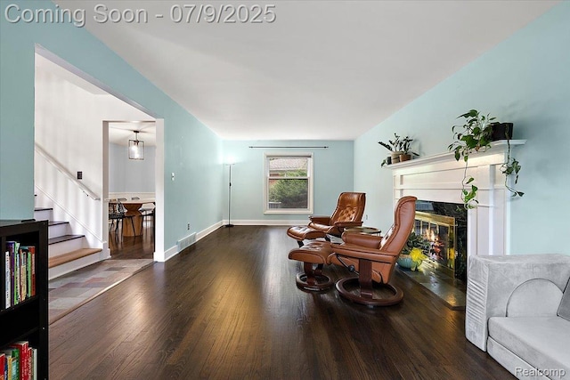 32010 Inglewood St, Franklin, MI 48025 - sitting room featuring wood finished floors, stairs, and a fireplace