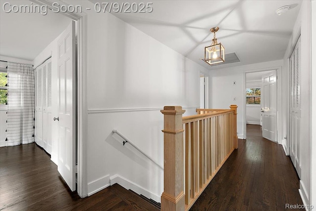32010 Inglewood St, Franklin, MI 48025 - corridor with an upstairs landing, healthy amount of natural light, and dark wood-type flooring
