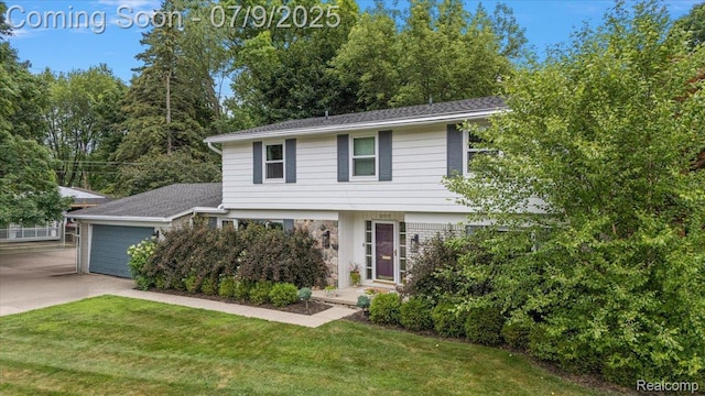 32010 Inglewood St, Franklin, MI 48025 - view of front of home with concrete driveway, a front yard, and a garage
