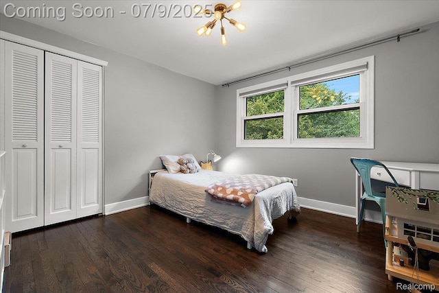 32010 Inglewood St, Franklin, MI 48025 - bedroom with wood finished floors, a closet, and a chandelier