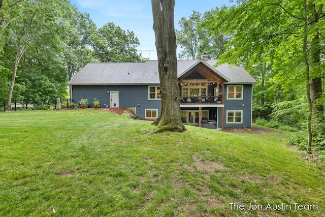 7979 Ella Terrace Dr, Rockford, MI 49341 - rear view of property with a chimney and a deck