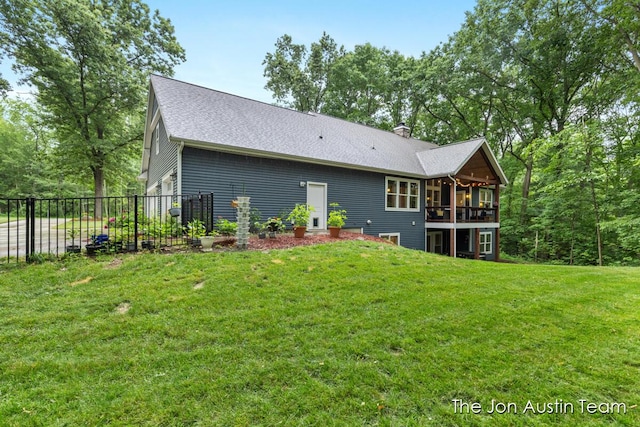 7979 Ella Terrace Dr, Rockford, MI 49341 - back of house featuring a shingled roof and a chimney