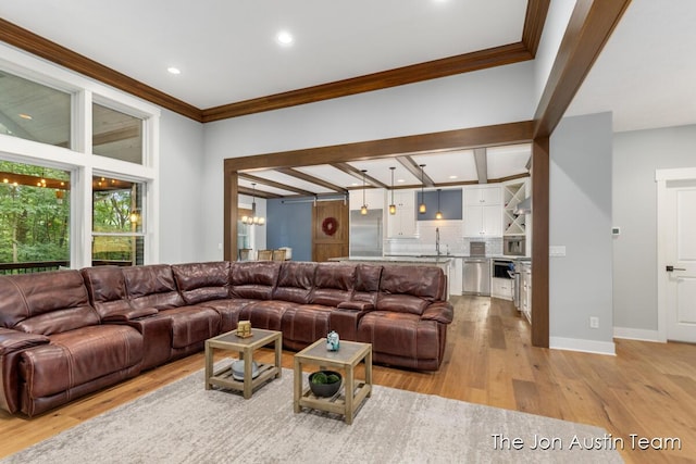 7979 Ella Terrace Dr, Rockford, MI 49341 - living area featuring ornamental molding, light wood-type flooring, recessed lighting, and a chandelier
