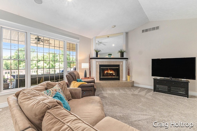 3566 Little Timber Ct SW, Grand Rapids, MI 49534 - living room featuring lofted ceiling, carpet flooring, and a tiled fireplace