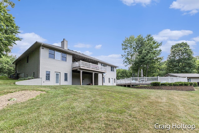 3566 Little Timber Ct SW, Grand Rapids, MI 49534 - back of property featuring a chimney, a deck, and a yard