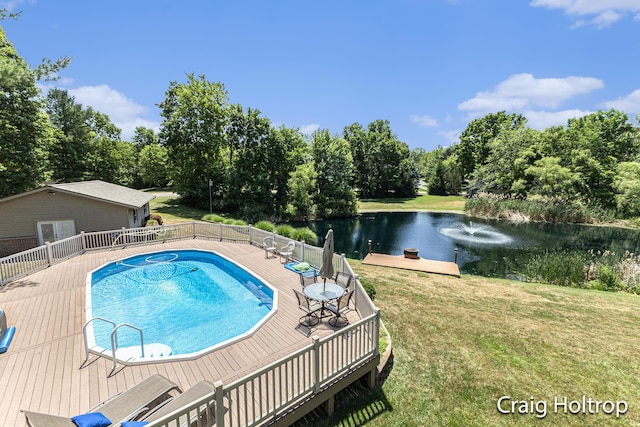 3566 Little Timber Ct SW, Grand Rapids, MI 49534 - view of pool with a deck with water view, a lawn, and view of scattered trees