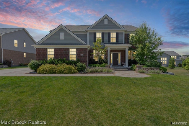 1043 Kendall Ct, Lake Orion, MI 48360 - view of front of property featuring brick siding and a lawn