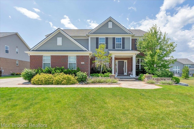 1043 Kendall Ct, Lake Orion, MI 48360 - view of front facade featuring brick siding and a front yard