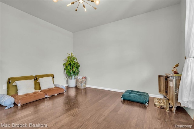 1043 Kendall Ct, Lake Orion, MI 48360 - living area featuring a chandelier and wood finished floors