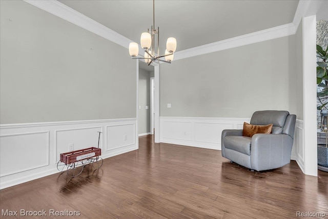 1043 Kendall Ct, Lake Orion, MI 48360 - sitting room with ornamental molding, a chandelier, a wainscoted wall, wood finished floors, and a decorative wall